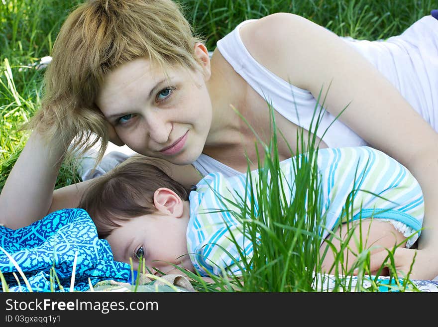 Young mother with little son at the park. Young mother with little son at the park