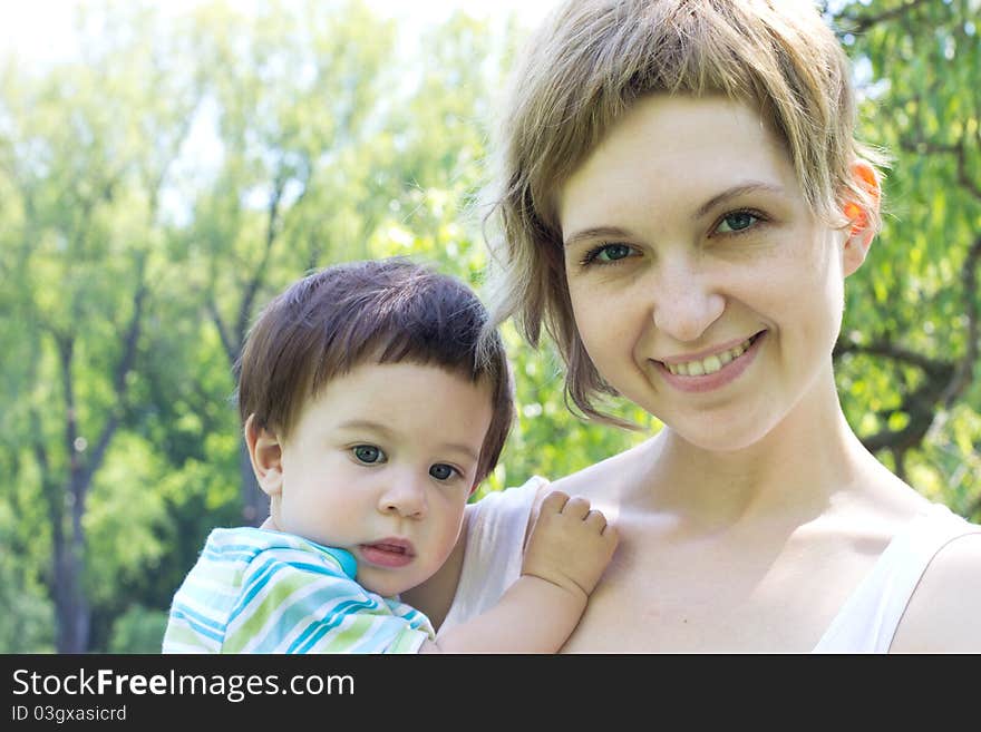 Young mother with little son at the park. Young mother with little son at the park