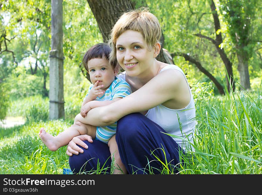 Young mother with little son at the park. Young mother with little son at the park