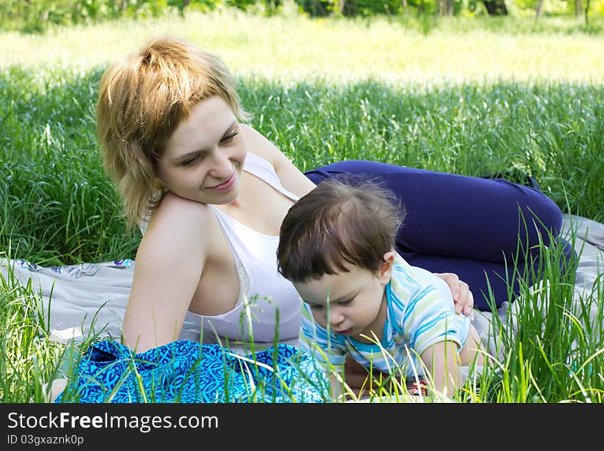 Young mother with little son at the park. Young mother with little son at the park