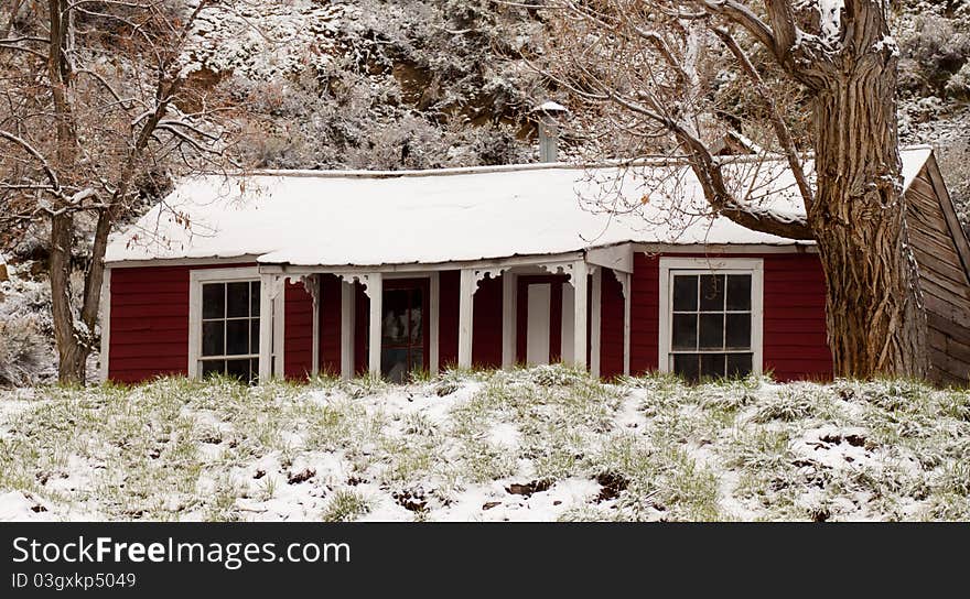 A beautiful photo of an old red house on a snowy day. A beautiful photo of an old red house on a snowy day.