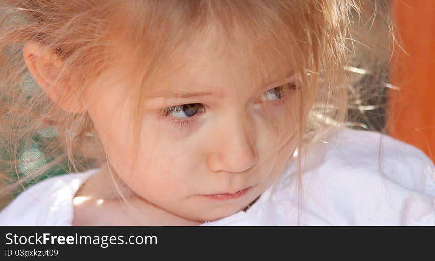 A photograph of an adorable child playing on some playground equipment. A photograph of an adorable child playing on some playground equipment.