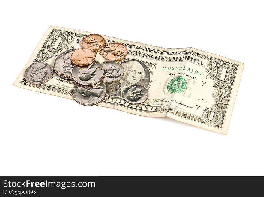 Pile of paper money and change on isolated white. Pile of paper money and change on isolated white