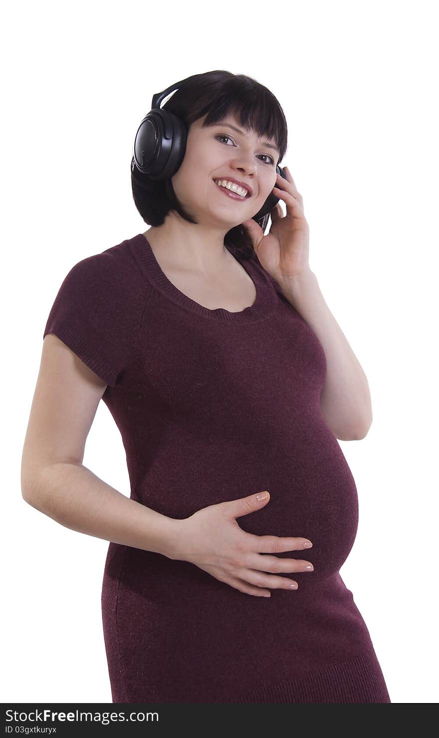 Pregnant woman listening to music.