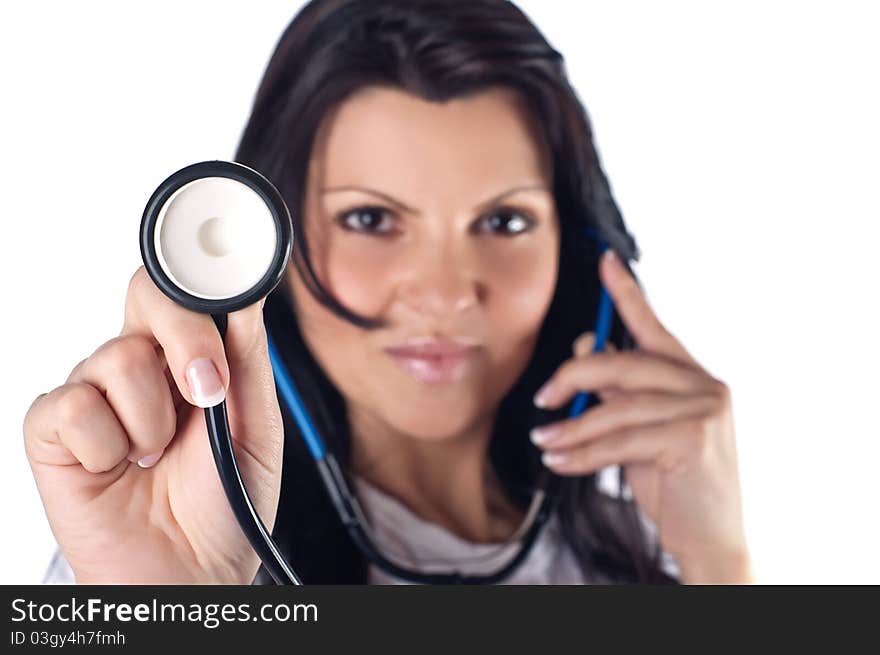 Pretty nurse holding stethoscope, studio shot