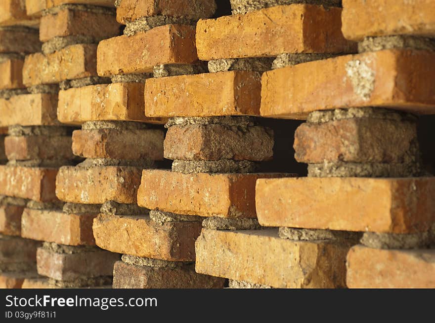 Photo of orange brick wall ornament cross