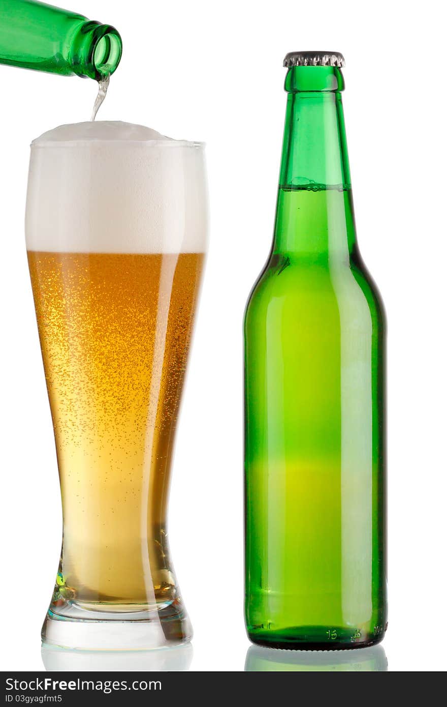 Cup and a bottle of beer on white background. Cup and a bottle of beer on white background