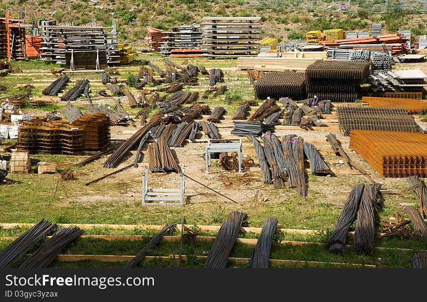 Construction material storage area with reinforcing steel mesh , iron rods and formwork material. Construction material storage area with reinforcing steel mesh , iron rods and formwork material