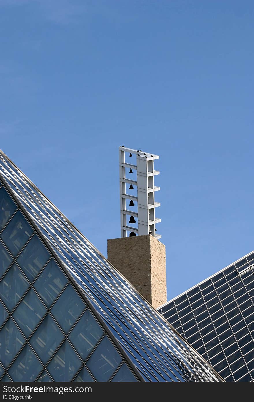 Carillon belltower between slanted rooftops. Carillon belltower between slanted rooftops.