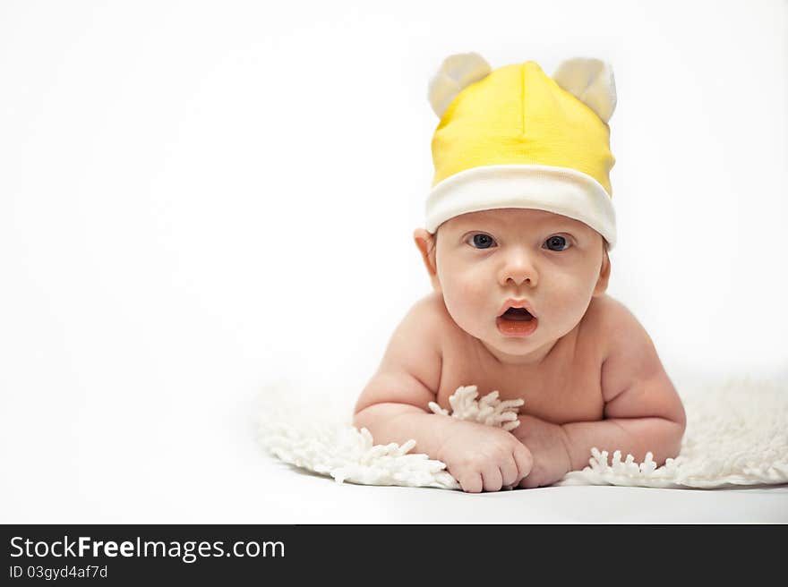 The little boy wearing the yellow hat. The little boy wearing the yellow hat