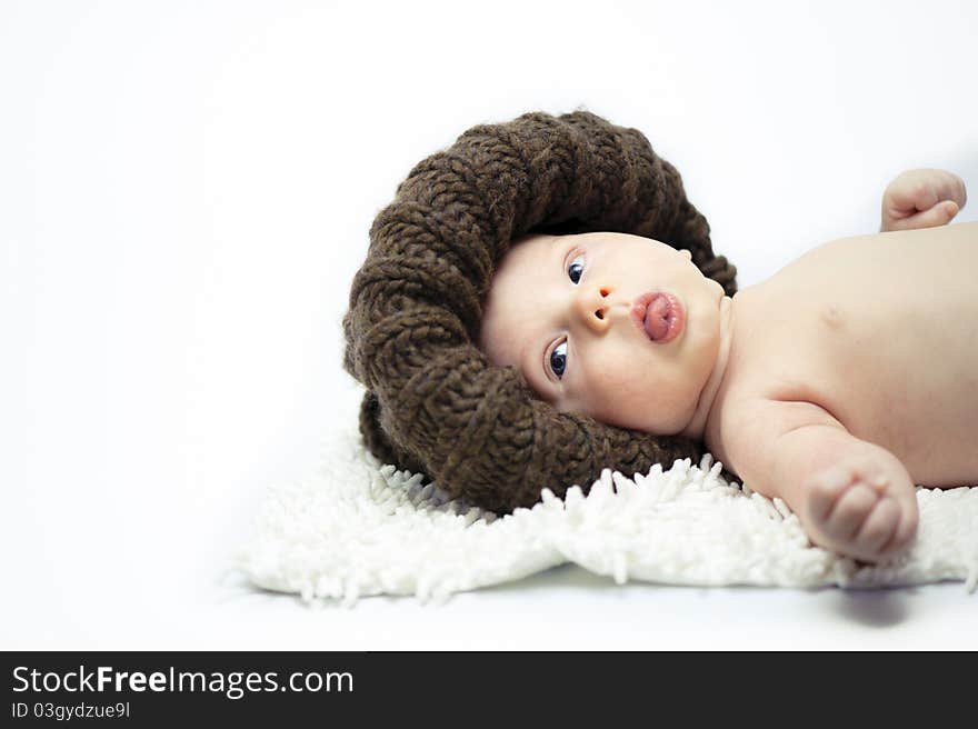 The little boy wearing the big brown hat. The little boy wearing the big brown hat