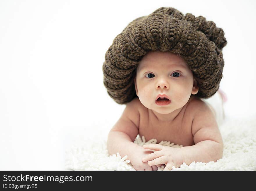 The little boy wearing the big brown hat. The little boy wearing the big brown hat