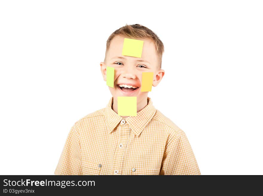 Portrait of a boy with colorful funny stickers on his face. Portrait of a boy with colorful funny stickers on his face.