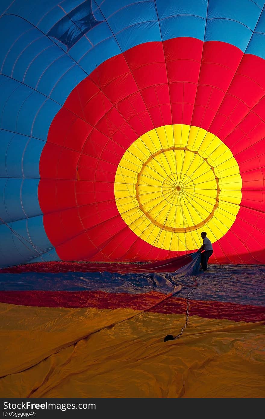 A Man and Colorful Hot Air Balloons (Interior)