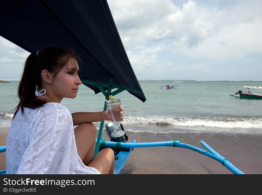 Young girl on the ocean s beach