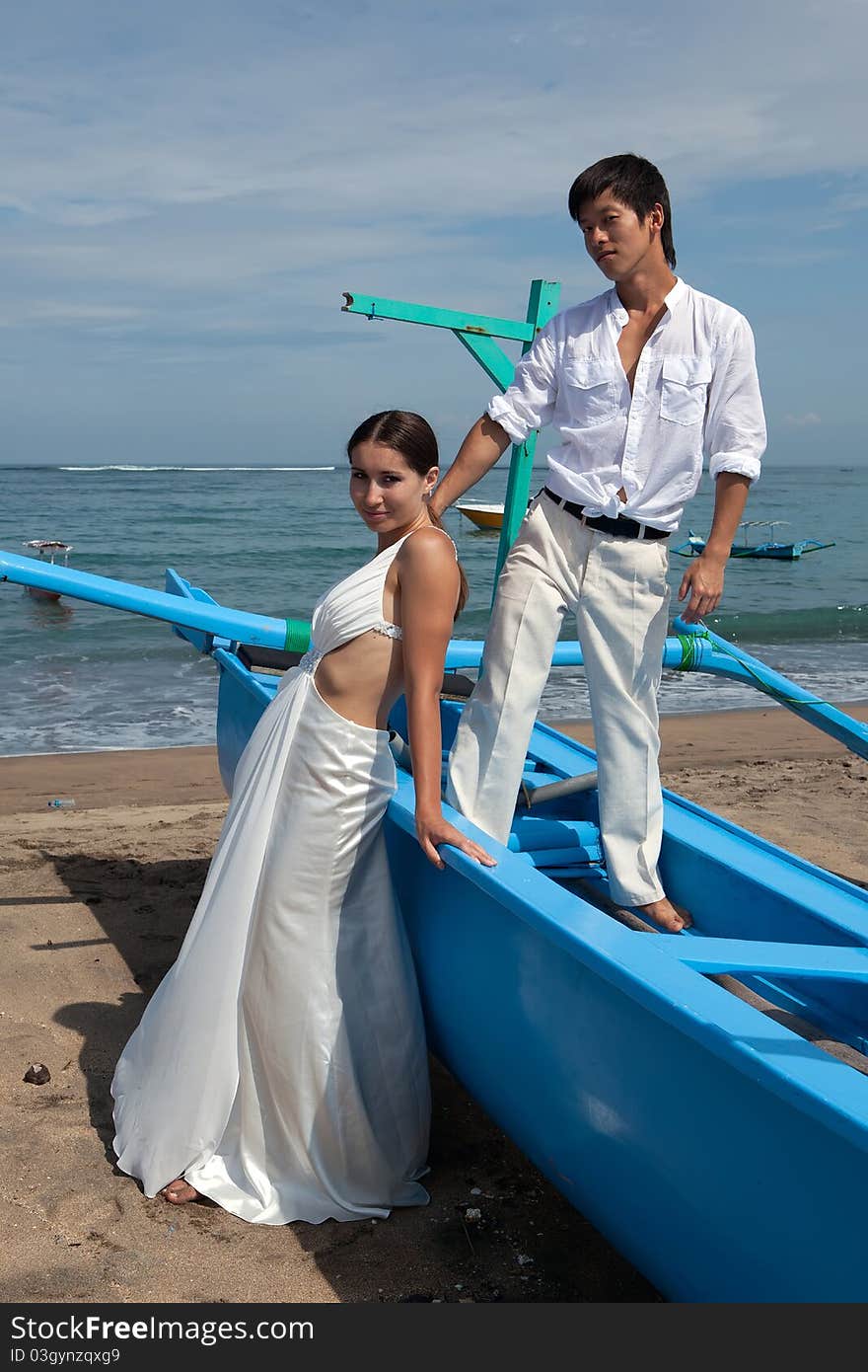 Romantic couple in white at the beach. Romantic couple in white at the beach