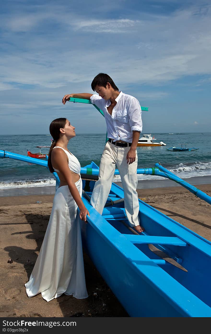 Romantic couple in white at the beach. Romantic couple in white at the beach