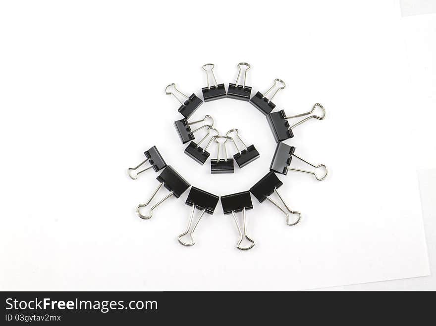 Binder clips in a circle isolated on white background