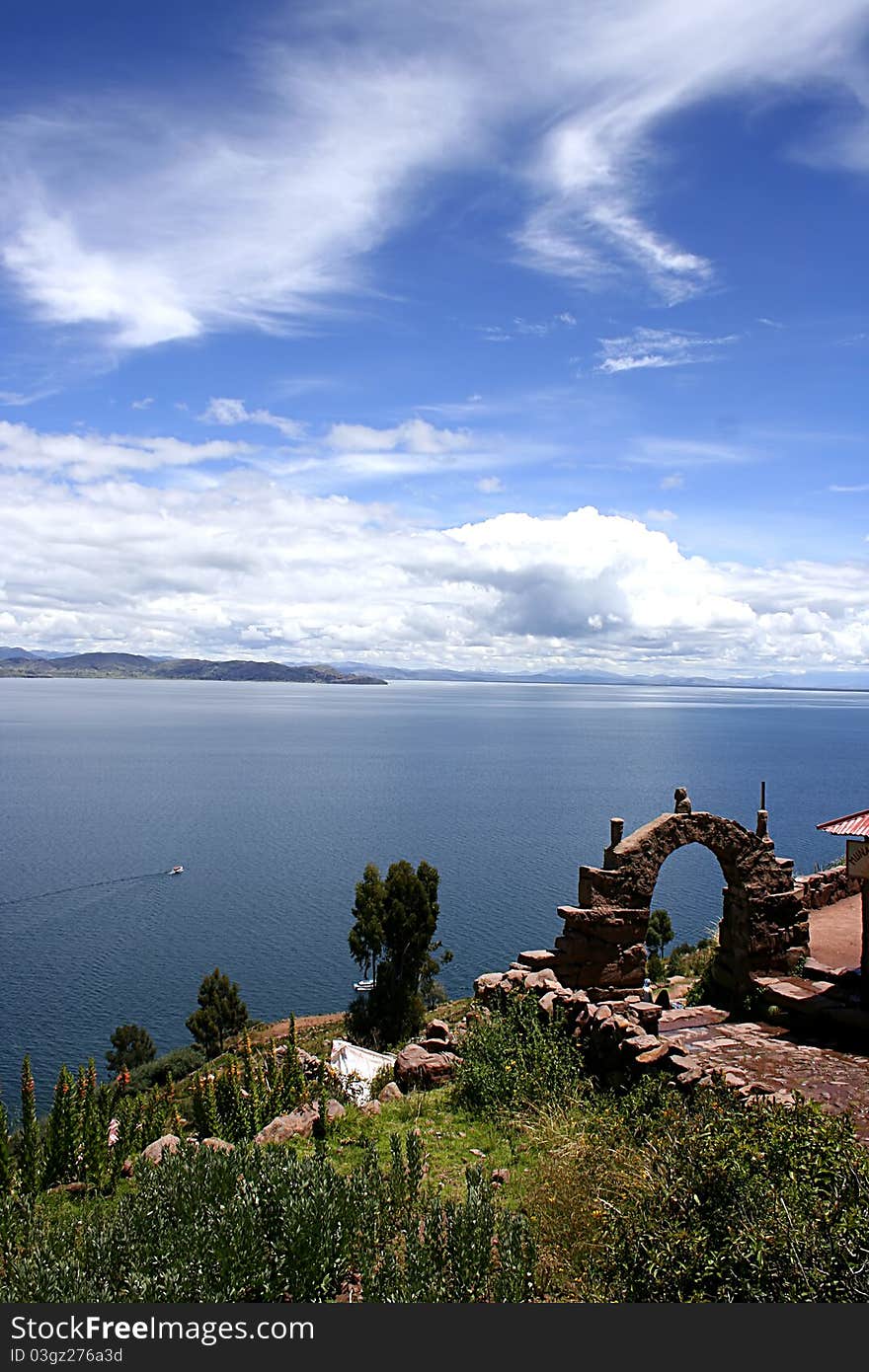 View from isla del sol Lake Titicaca through an ancient stone arch