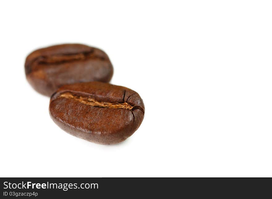 Aromatic coffee beans on a white background. Aromatic coffee beans on a white background.