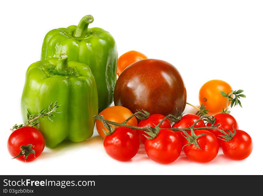 Green paprika and colorful tomatoes for a salad. Green paprika and colorful tomatoes for a salad.