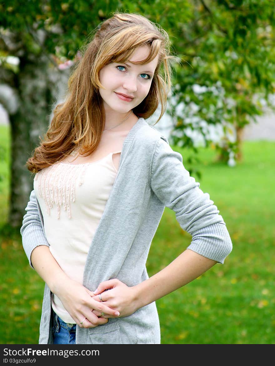 Pretty teen girl striking a pose in the great outdoors. Pretty teen girl striking a pose in the great outdoors