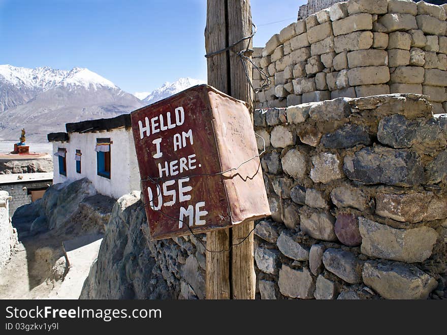 Handmade trash can against himalayan mountains and a brick wall as a means to keep Himalayas clean. Handmade trash can against himalayan mountains and a brick wall as a means to keep Himalayas clean.