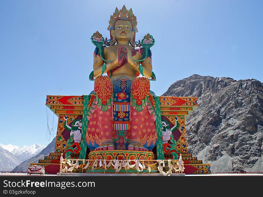 Buddhist Statue Against Himalayas