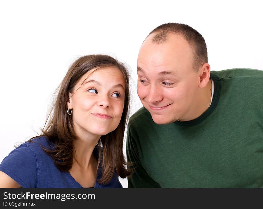 Young couple smiling with silly expressions. Young couple smiling with silly expressions.