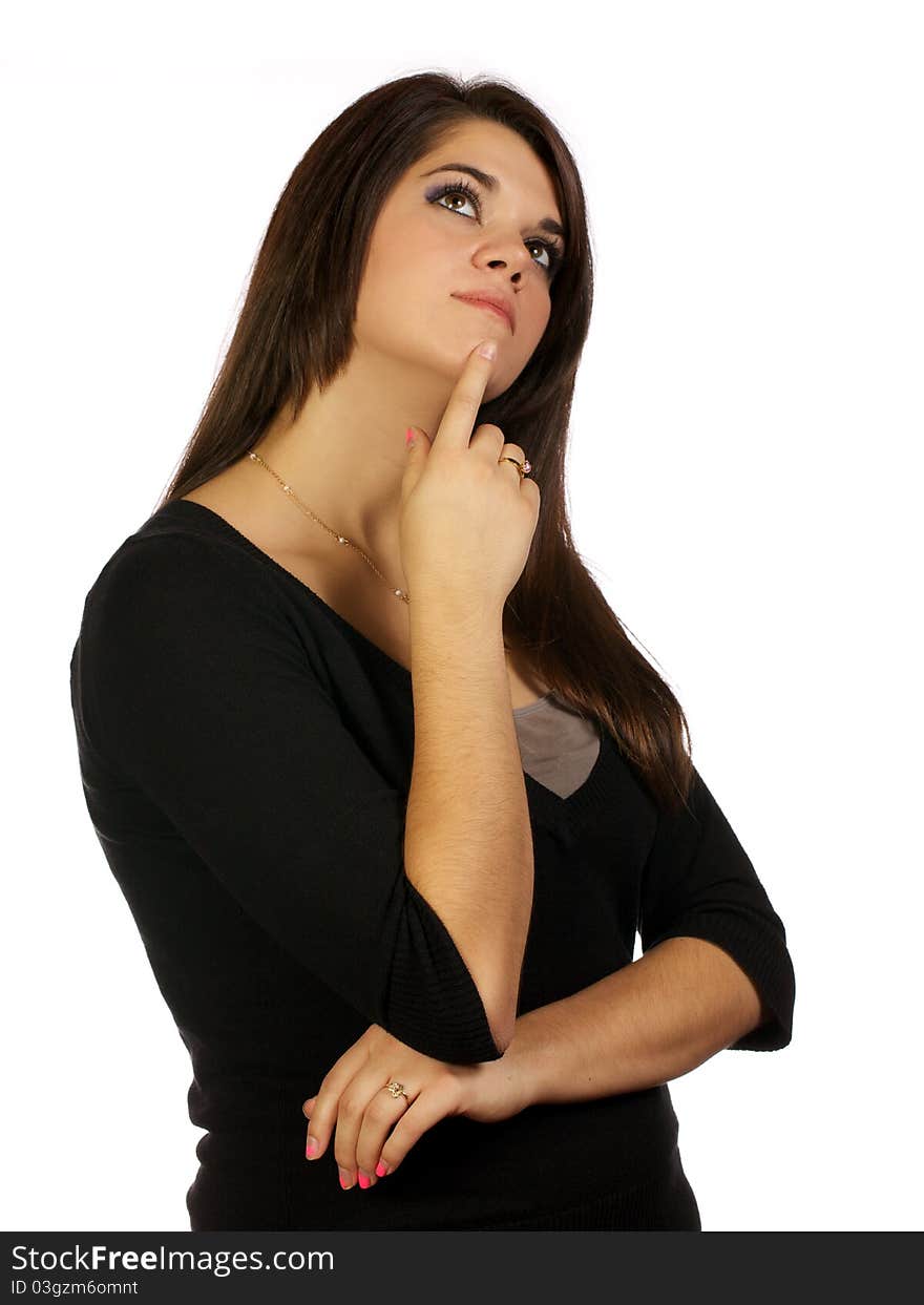 Young woman with her finger on her chin looking up in contemplation. Young woman with her finger on her chin looking up in contemplation