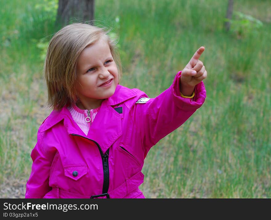 Portrait of european girl with points to something. Portrait of european girl with points to something