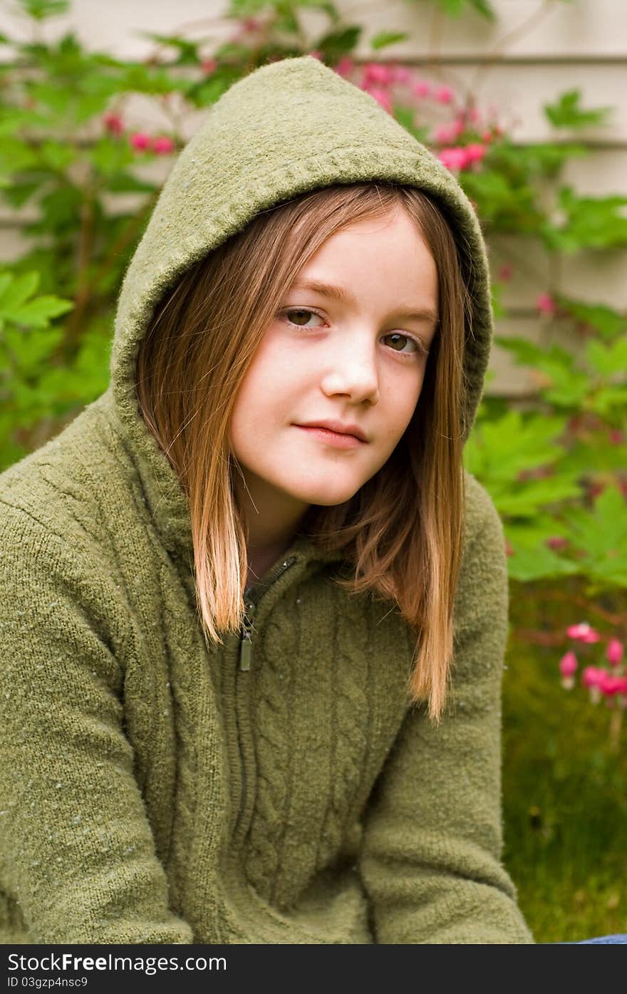 A portrait of a young girl in the garden. A portrait of a young girl in the garden.