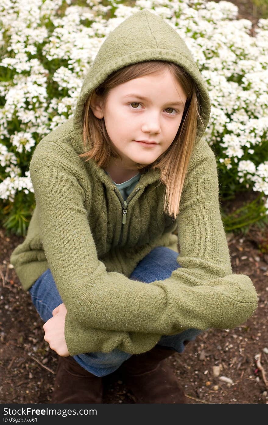 A portrait of a young girl in the garden. A portrait of a young girl in the garden.