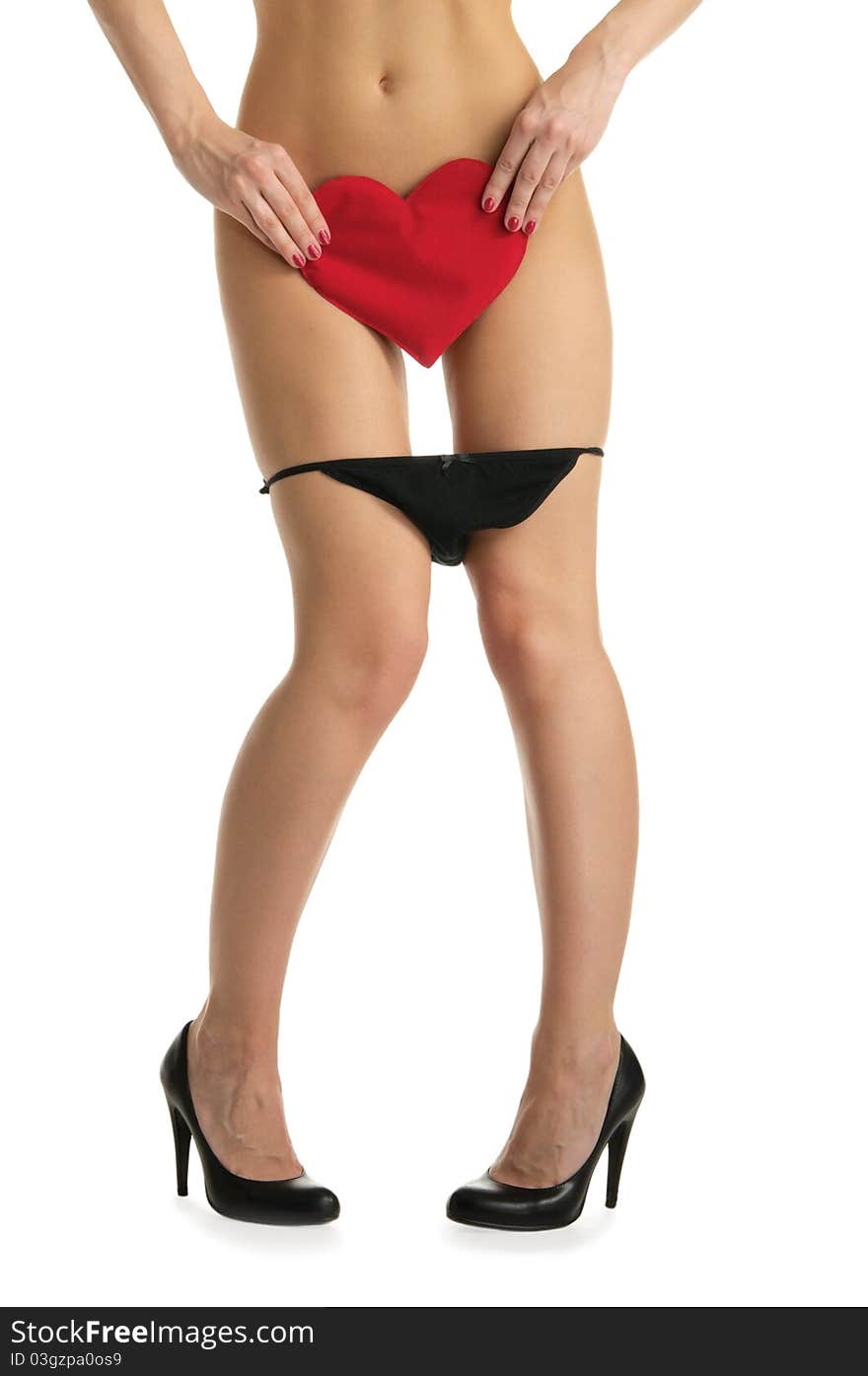 Female legs with black panties and heart