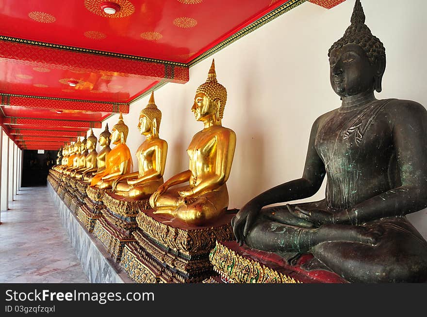 Golden Sitting Buddha Statues In Wat Pho