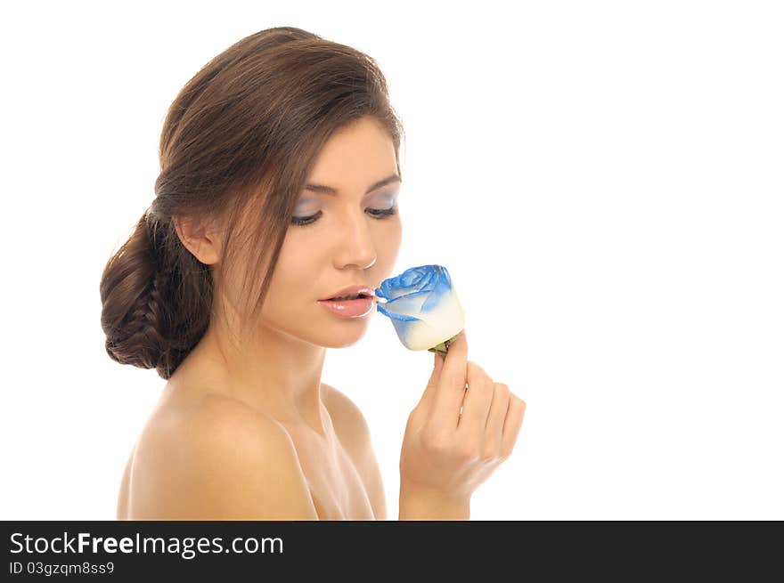 Beautiful brunette with blue rose isolated on white