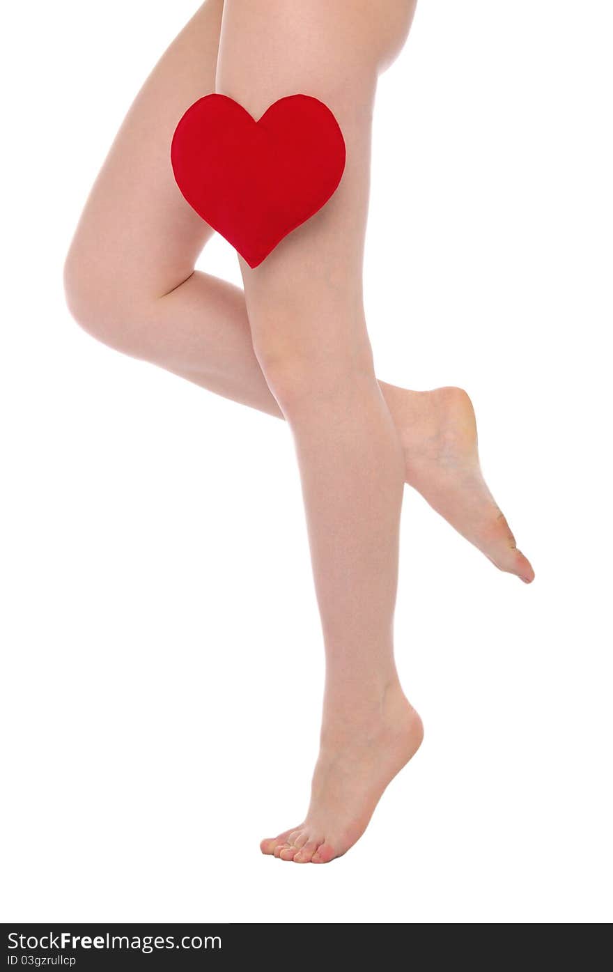 Female legs with red heart