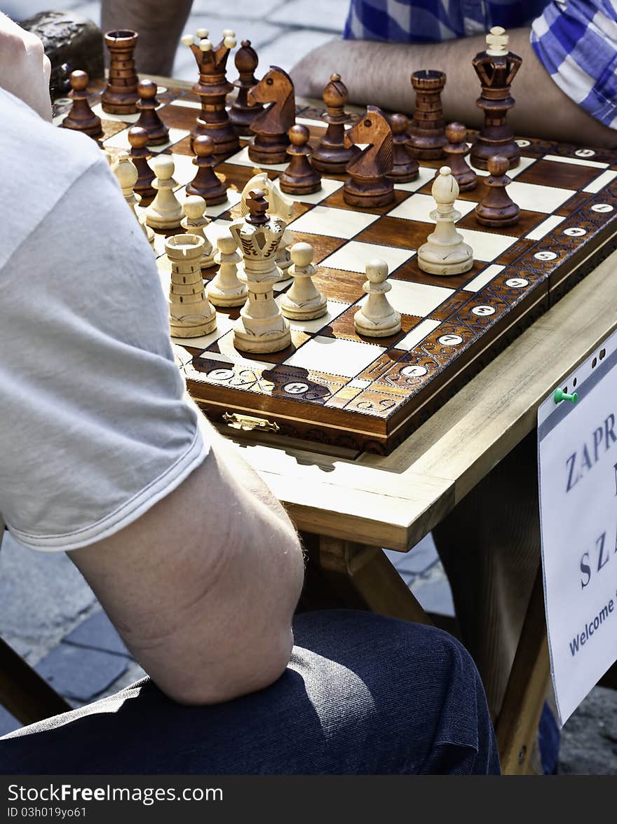 Chess mates playing in the city