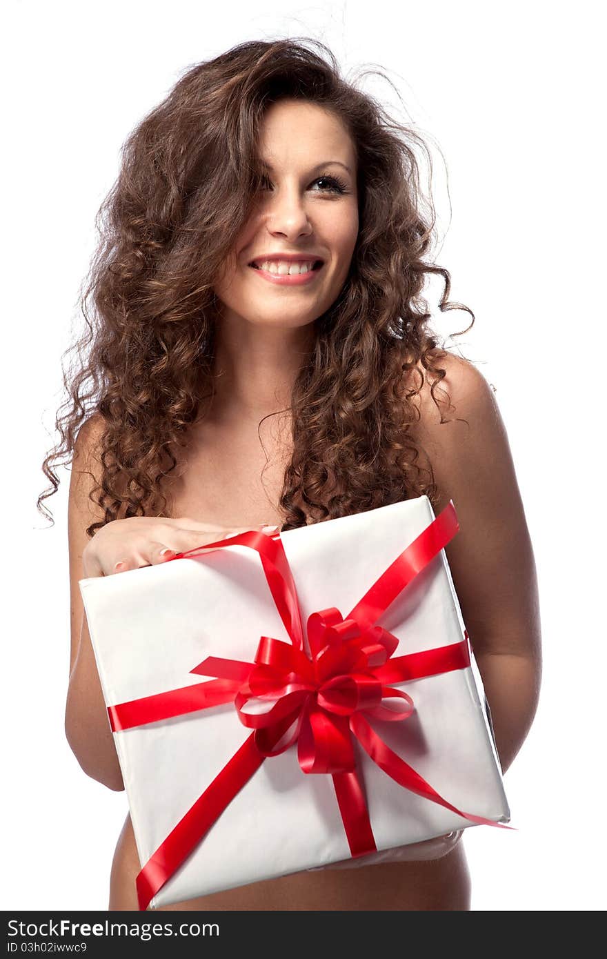 Naked smiling woman holding gift isolated