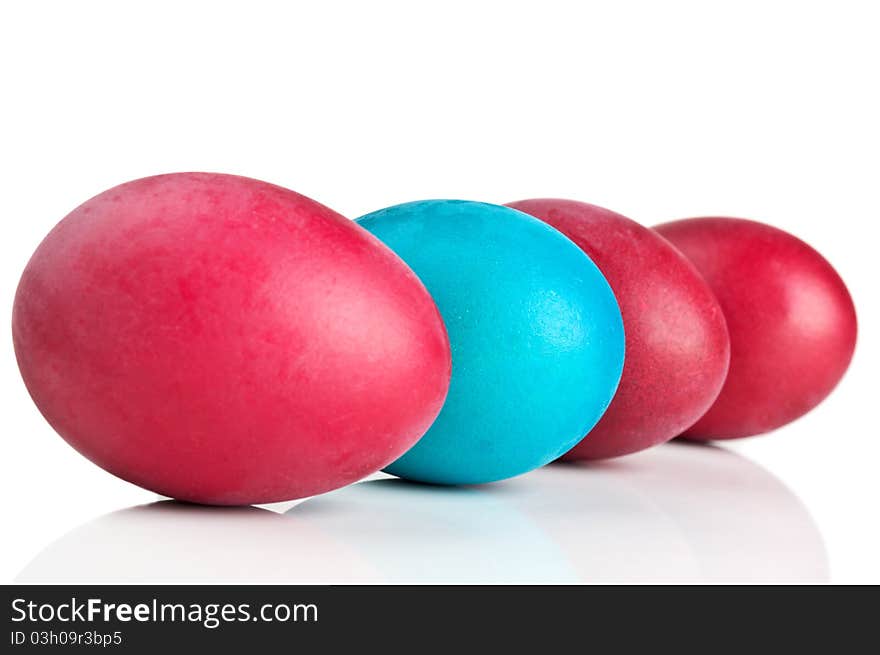 Red and blue eggs isolated on a white background