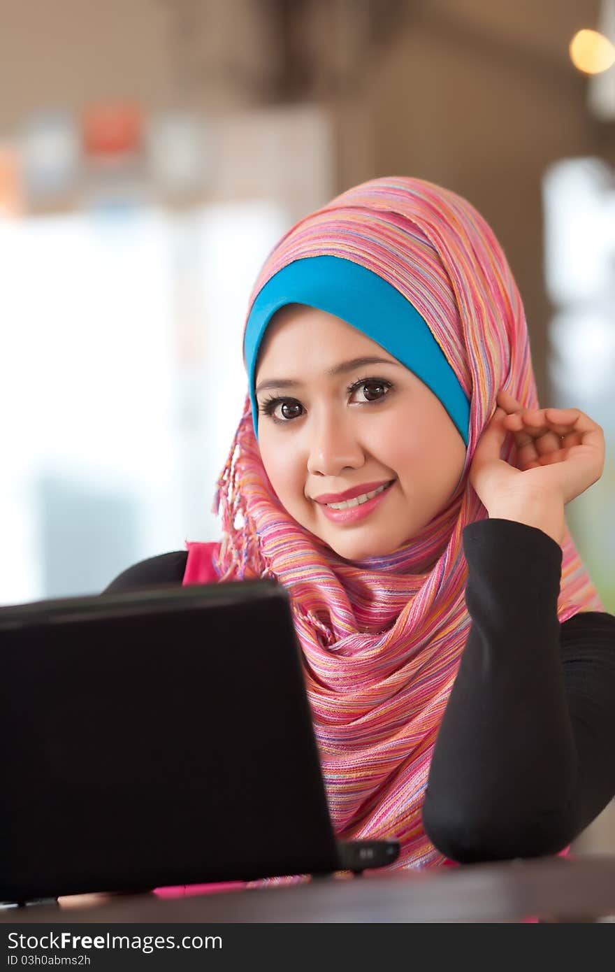 Portrait of the pretty muslim woman with the laptop. Portrait of the pretty muslim woman with the laptop