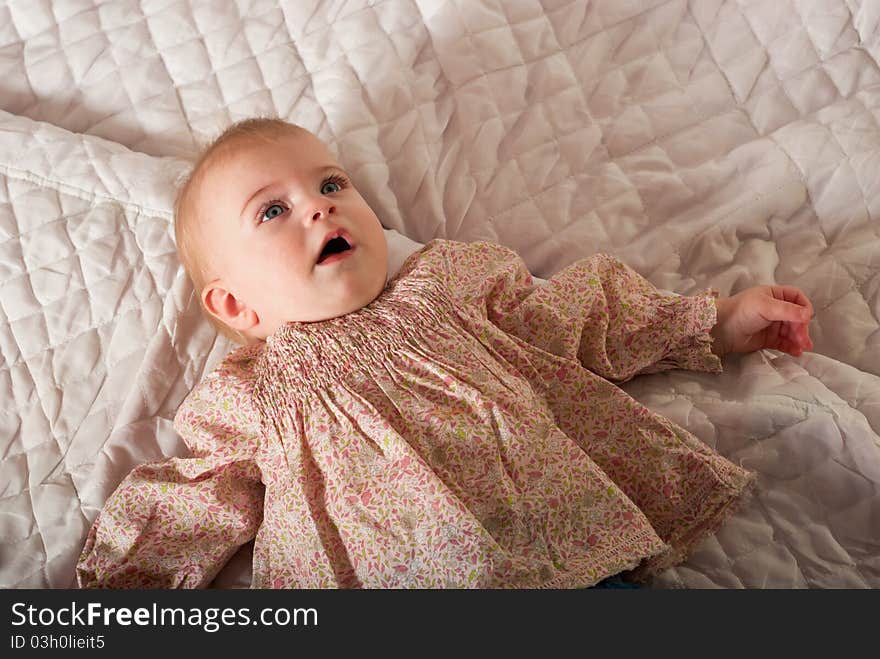 Closeup portrait of cute baby girl. Studio shot