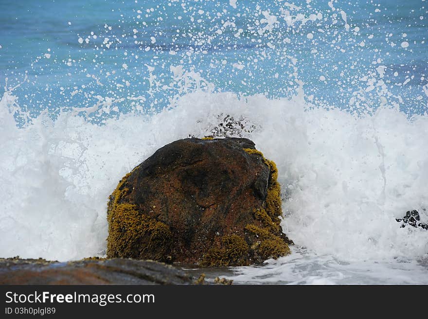 Powerful force of the Ocean is re-shaping this rock another little bit of a fraction. Powerful force of the Ocean is re-shaping this rock another little bit of a fraction.