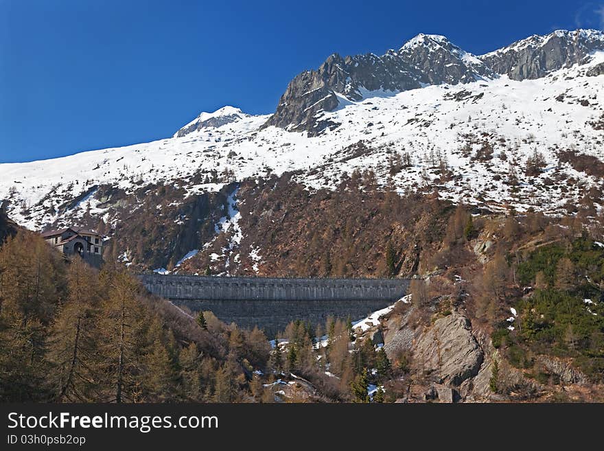 Dam at the end of Arno man-made lake basin at 1900 meters on the sea-level. Brixia province, Lombardy region, Italy