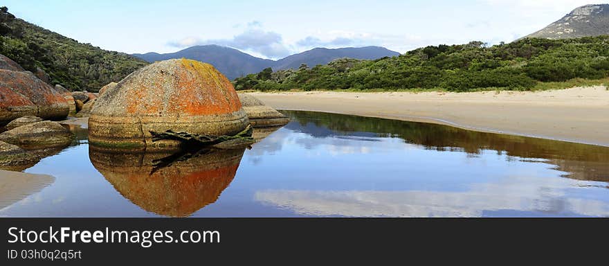 Tranquil and peaceful scene at river with mountain range in the background in Wilsons Promontory National Park, Victoria, Australia. Tranquil and peaceful scene at river with mountain range in the background in Wilsons Promontory National Park, Victoria, Australia.