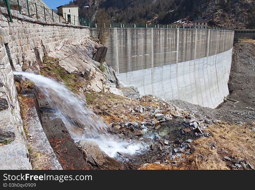 Dam at the end of Arno man-made lake basin at 1900 meters on the sea-level. Brixia province, Lombardy region, Italy