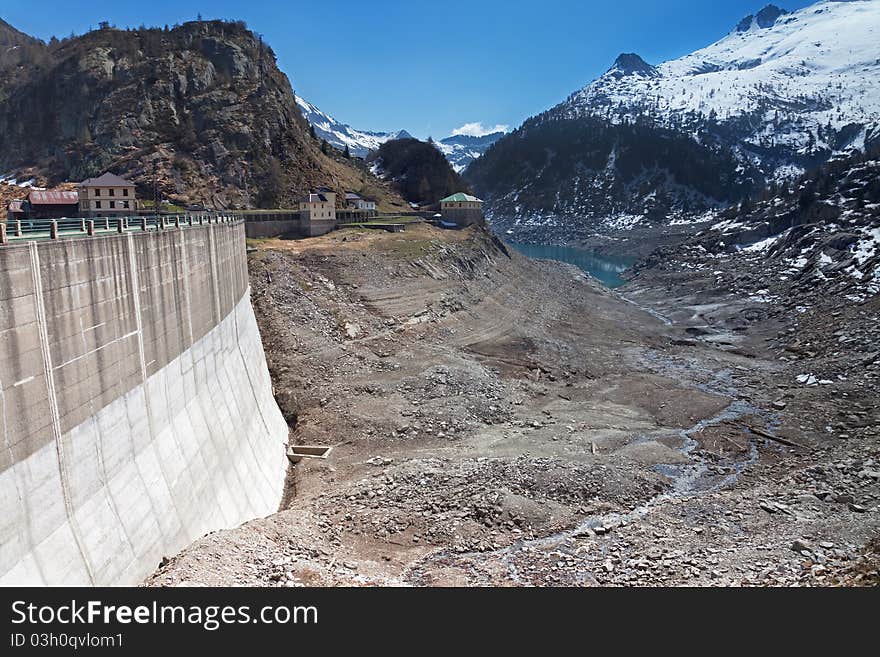 Dam at the end of Arno man-made lake basin at 1900 meters on the sea-level. Brixia province, Lombardy region, Italy