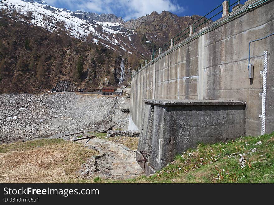 Dam at the end of Arno man-made lake basin at 1900 meters on the sea-level. Brixia province, Lombardy region, Italy