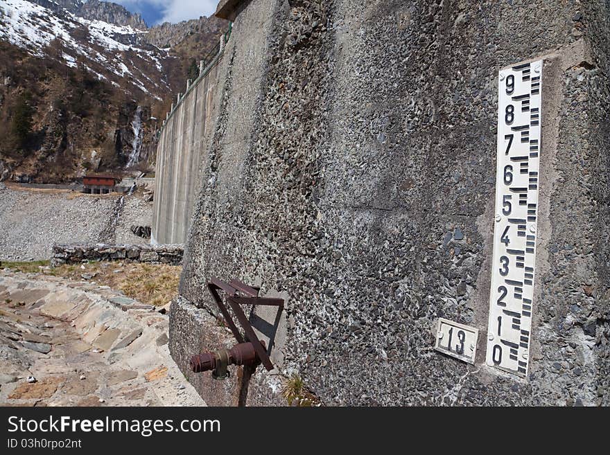 Dam at the end of Arno man-made lake basin at 1900 meters on the sea-level. Brixia province, Lombardy region, Italy