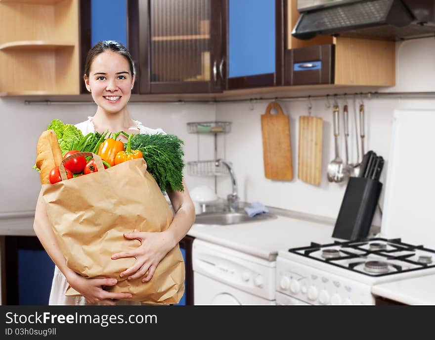 Young Beautiful Caucasian Woman In The Kitchen